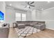 Spacious living room with a plush sectional and a modern ceiling fan at 348 Spindlewood Way, Charleston, SC 29414