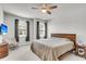 The main bedroom features a ceiling fan, two windows with blinds, and modern decor at 348 Spindlewood Way, Charleston, SC 29414