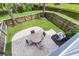 Paver patio with outdoor seating area overlooking a tranquil pond, perfect for relaxation at 348 Spindlewood Way, Charleston, SC 29414