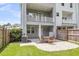 Back patio and balcony with outdoor seating offering backyard views, great for entertaining at 348 Spindlewood Way, Charleston, SC 29414