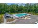 Overhead view of a refreshing community pool with lounge chairs, a pool house, and parking at 348 Spindlewood Way, Charleston, SC 29414