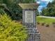 Welcome to Grand Terrace: elegant community entrance sign with brick base and manicured landscaping at 348 Spindlewood Way, Charleston, SC 29414