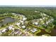 Aerial view of a neighborhood with ponds, green spaces, and homes nestled among mature trees at 3739 Goodwater St, Mount Pleasant, SC 29466