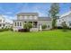 Lush backyard with green lawn and mature trees, offering privacy and shade for outdoor enjoyment at 3739 Goodwater St, Mount Pleasant, SC 29466