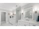 Luxury bathroom featuring dual vanities, white cabinetry, marble floors, and stylish fixtures at 3739 Goodwater St, Mount Pleasant, SC 29466