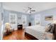 Inviting bedroom filled with natural light, wood floors, ceiling fan, and tasteful decor, creating a cozy ambiance at 3739 Goodwater St, Mount Pleasant, SC 29466