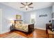 Charming bedroom with hardwood floors, ceiling fan, and large windows, designed for comfort and relaxation at 3739 Goodwater St, Mount Pleasant, SC 29466