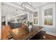 Inviting breakfast room with modern light fixture and view into the kitchen and Gathering room at 3739 Goodwater St, Mount Pleasant, SC 29466