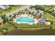 Expansive aerial view of a community pool surrounded by lush landscaping, lounge chairs, and shaded seating areas at 3739 Goodwater St, Mount Pleasant, SC 29466