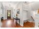 Inviting foyer featuring hardwood floors, a staircase, and a convenient built-in storage area at 3739 Goodwater St, Mount Pleasant, SC 29466