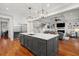 Modern kitchen with center island, stainless steel appliances, and an open view into the adjacent Gathering room at 3739 Goodwater St, Mount Pleasant, SC 29466
