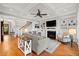 Cozy living room with coffered ceilings, built-in shelving, a fireplace, and a staircase at 3739 Goodwater St, Mount Pleasant, SC 29466