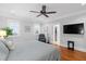 Beautiful bedroom features hardwood floors, plush chair, and ample natural light at 3739 Goodwater St, Mount Pleasant, SC 29466