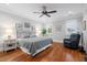 Inviting bedroom featuring hardwood floors, a queen-sized bed, and neutral decor at 3739 Goodwater St, Mount Pleasant, SC 29466