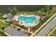 Aerial view of a community pool area featuring lounge chairs, umbrellas, palm trees and covered seating areas at 3739 Goodwater St, Mount Pleasant, SC 29466