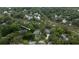 Aerial view of a home nestled among lush trees, showcasing its private waterway access at 375 Seewee Cir, Mount Pleasant, SC 29464
