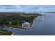 Breathtaking view of a waterfront community featuring a pool, marina, and bridge in the background at 375 Seewee Cir, Mount Pleasant, SC 29464