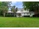Expansive backyard featuring a screened porch and lush green lawn, perfect for outdoor entertaining and relaxation at 375 Seewee Cir, Mount Pleasant, SC 29464