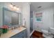 Charming bathroom with custom vanity, stylish mirror, and glass enclosed shower at 375 Seewee Cir, Mount Pleasant, SC 29464