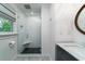 Modern bathroom featuring subway tile shower, pebble floor, and granite countertop at 375 Seewee Cir, Mount Pleasant, SC 29464