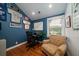 Stylish bedroom with hardwood floors, comfortable armchair, and sports memorabilia on display at 375 Seewee Cir, Mount Pleasant, SC 29464