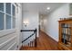 Bright hallway with hardwood floors, white trim, and decorative bookcase at 375 Seewee Cir, Mount Pleasant, SC 29464