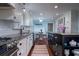 Bright kitchen with white cabinets, granite countertops, stainless steel appliances, and a cozy breakfast nook at 375 Seewee Cir, Mount Pleasant, SC 29464