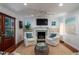 Bright living room with fireplace, and wood doors leading to the outdoors at 375 Seewee Cir, Mount Pleasant, SC 29464