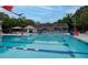 Beautiful swimming pool with clear water, red-white-blue lane markers and lounge seating at 375 Seewee Cir, Mount Pleasant, SC 29464