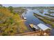 Aerial view of community boat docks surrounded by marshlands and pristine waterways at 3871 Sawyers Island Dr, Mount Pleasant, SC 29466