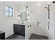 Modern bathroom featuring subway tile shower, dark herringbone floors, and stylish vanity with black hardware at 3871 Sawyers Island Dr, Mount Pleasant, SC 29466