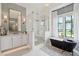 Well-lit bathroom with modern fixtures including tub, shower, and vanity at 3871 Sawyers Island Dr, Mount Pleasant, SC 29466