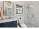 Modern bathroom with a glass-enclosed shower, marble vanity, and stylish fixtures at 3871 Sawyers Island Dr, Mount Pleasant, SC 29466
