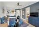 Bedroom with hardwood floors, baseball theme, blue accent wall, and a view to the en suite bathroom at 3871 Sawyers Island Dr, Mount Pleasant, SC 29466
