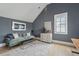 Cozy sitting area with gray walls, a plush couch, a bench, and natural light from the window at 3871 Sawyers Island Dr, Mount Pleasant, SC 29466