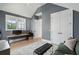 Sitting area with gray walls, a desk, and a plush couch under a vaulted ceiling at 3871 Sawyers Island Dr, Mount Pleasant, SC 29466