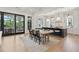 Open-concept dining area with a modern table, chairs, and seamless access to the kitchen at 3871 Sawyers Island Dr, Mount Pleasant, SC 29466
