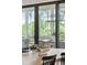 Elegant dining room featuring a modern chandelier and a view of the lush green landscape at 3871 Sawyers Island Dr, Mount Pleasant, SC 29466