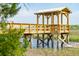 Close up of a community wooden dock on pilings showing the surrounding tidal marshlands at 3871 Sawyers Island Dr, Mount Pleasant, SC 29466