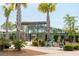Welcome to Lake Club, complete with palm trees and a charming entrance for residents to enjoy at 3871 Sawyers Island Dr, Mount Pleasant, SC 29466