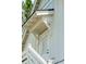 Close-up of a charming entrance with a white door and wooden staircase, with meticulous trim at 3871 Sawyers Island Dr, Mount Pleasant, SC 29466