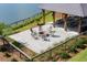 Community fire pit area with seating and picturesque lake views, ideal for gathering and relaxing outdoors at 3871 Sawyers Island Dr, Mount Pleasant, SC 29466