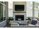 Cozy screened-in porch with fireplace, TV, and comfortable seating at 3871 Sawyers Island Dr, Mount Pleasant, SC 29466