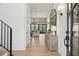 Bright foyer leading into living area, featuring wood floors, iron railing and natural light at 3871 Sawyers Island Dr, Mount Pleasant, SC 29466