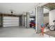 Spacious garage featuring epoxy floors, a golf cart, and ample storage space for vehicles and equipment at 3871 Sawyers Island Dr, Mount Pleasant, SC 29466