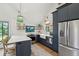 Modern kitchen featuring navy cabinets, stainless steel appliances, and a bright, open design at 3871 Sawyers Island Dr, Mount Pleasant, SC 29466