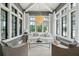 Bright living room with vaulted ceilings, large windows, and a decorative chandelier at 3871 Sawyers Island Dr, Mount Pleasant, SC 29466