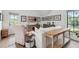 Cozy living room featuring shiplap walls, natural light, and stylish decor perfect for relaxation at 3871 Sawyers Island Dr, Mount Pleasant, SC 29466