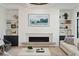 Stylish living room with custom built-ins, fireplace, and sleek modern decor at 3871 Sawyers Island Dr, Mount Pleasant, SC 29466
