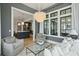 Elegant living room with dark walls, a chandelier, and views into the kitchen at 3871 Sawyers Island Dr, Mount Pleasant, SC 29466